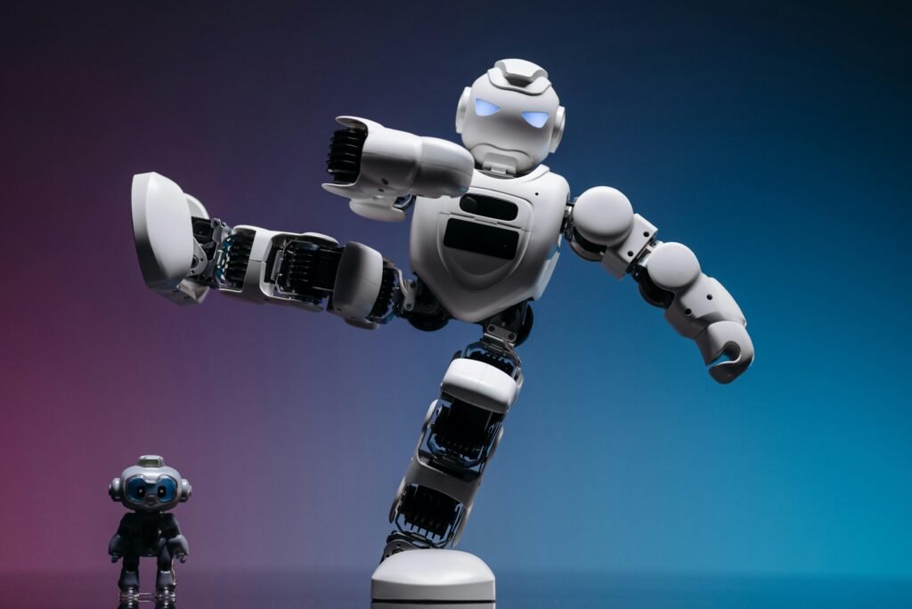Close-up of two futuristic robots in a studio setting, showcasing advanced robotics and innovation.